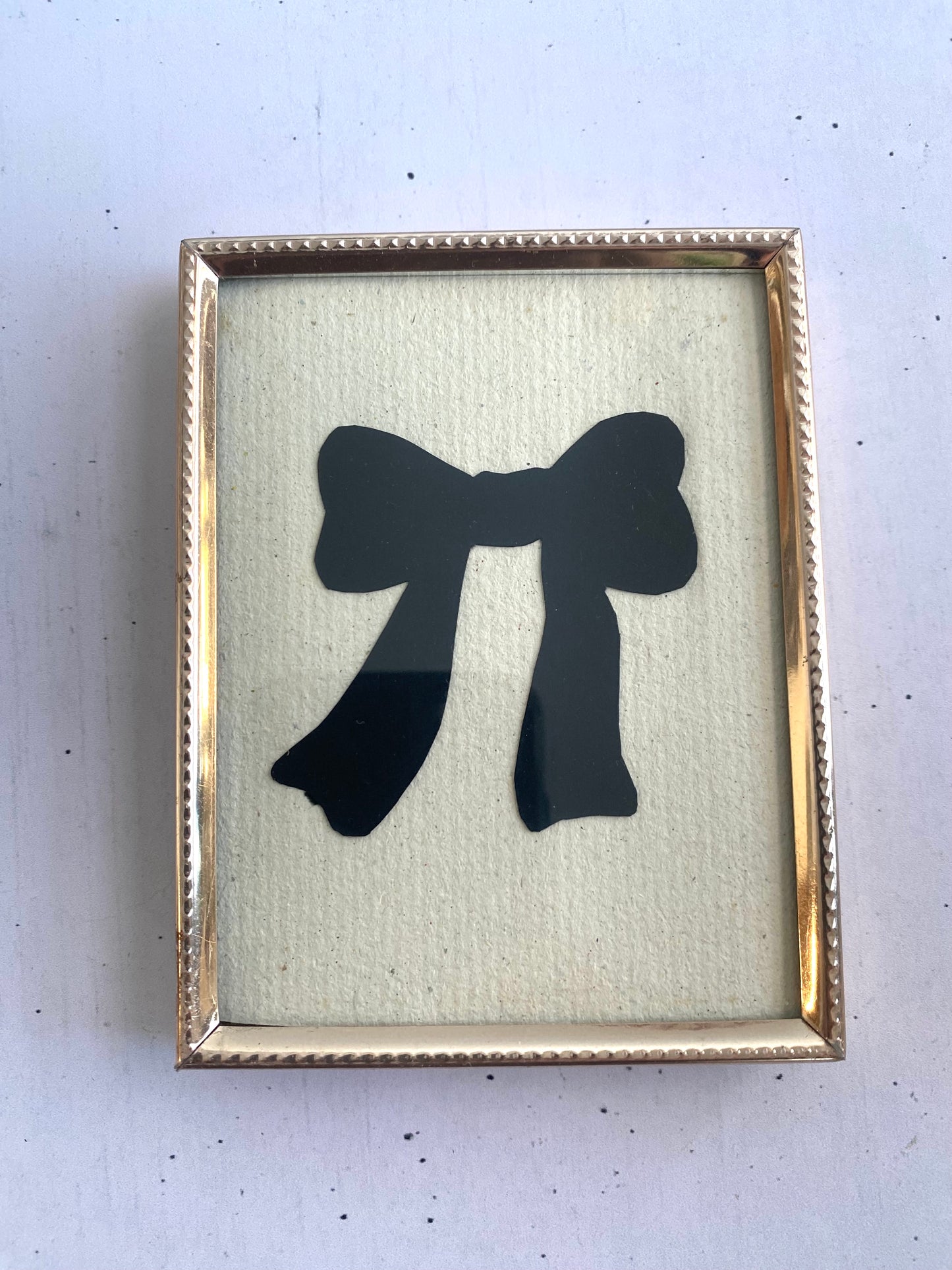 Hand-Cut Bow Silhouette in a Vintage Frame